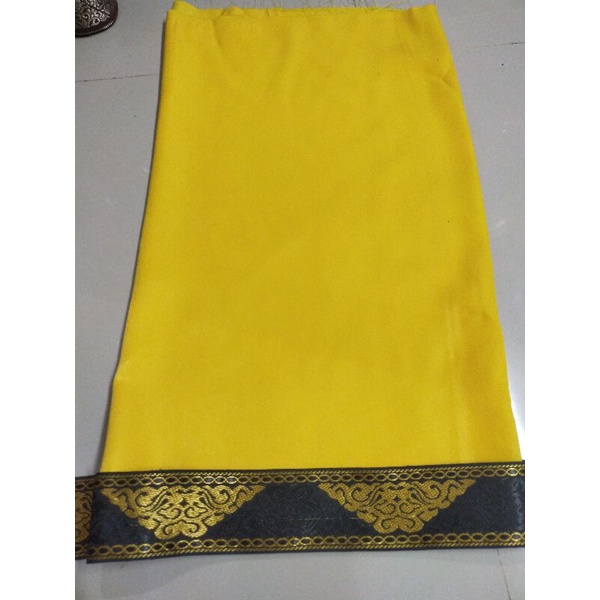 Saput kuning tepi songket khas bali