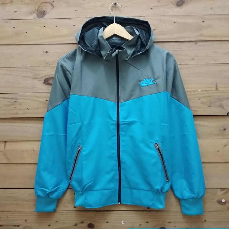 Jaket parasut nike abu biru muda