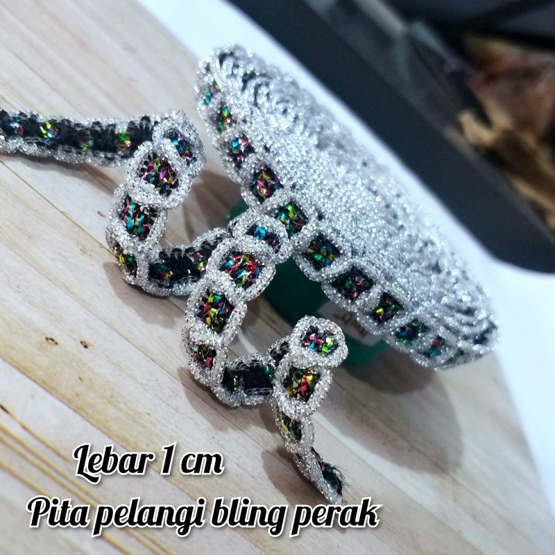 

per meter,pita pelangi india lebar 1 cm