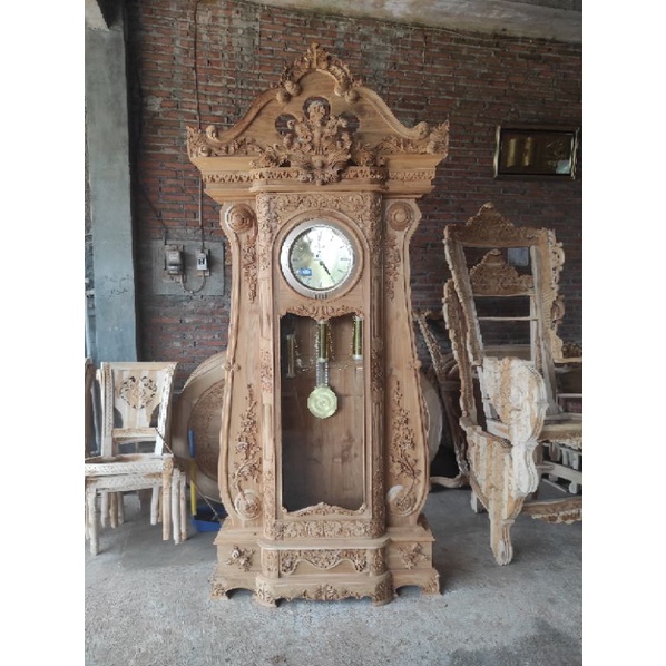 lemari jam hias bagong kayu jati