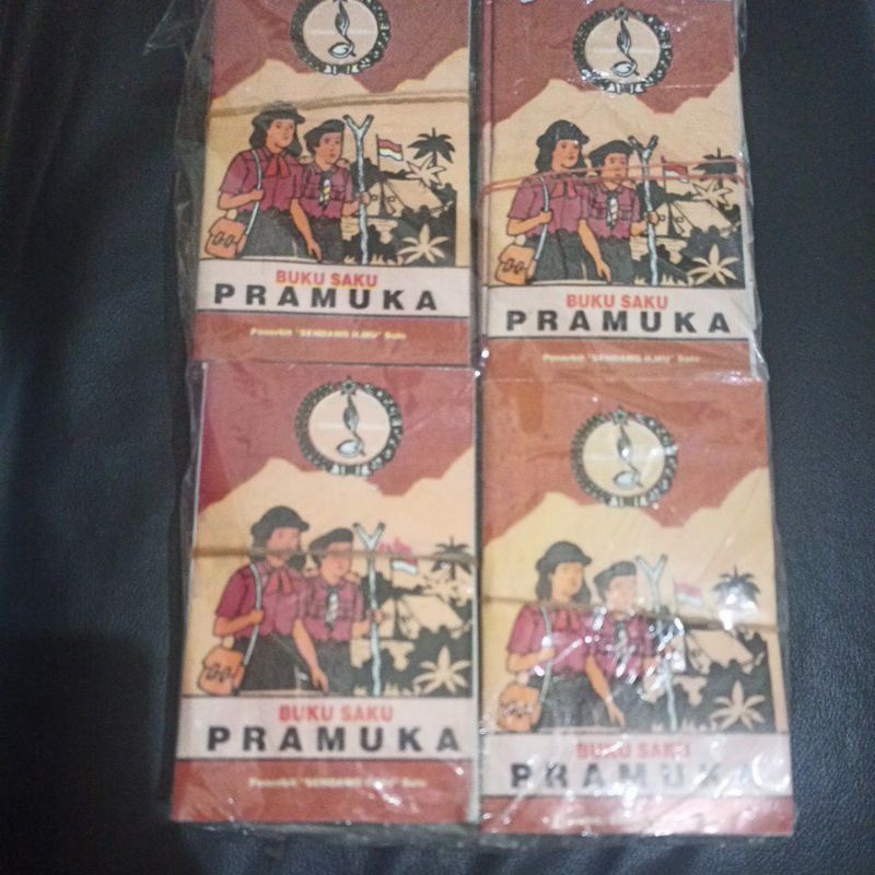 buku saku Pramuka 100 biji background warna coklat dan warna putih terbaru