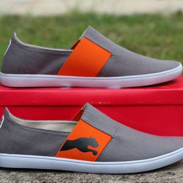 Sepatu slip on pria puma abu orange