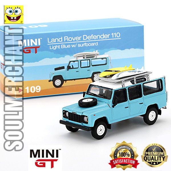 MINI GT 109 LAND ROVER DEFENDER 110 LIGHT BLUE with SURFBOARD RHD