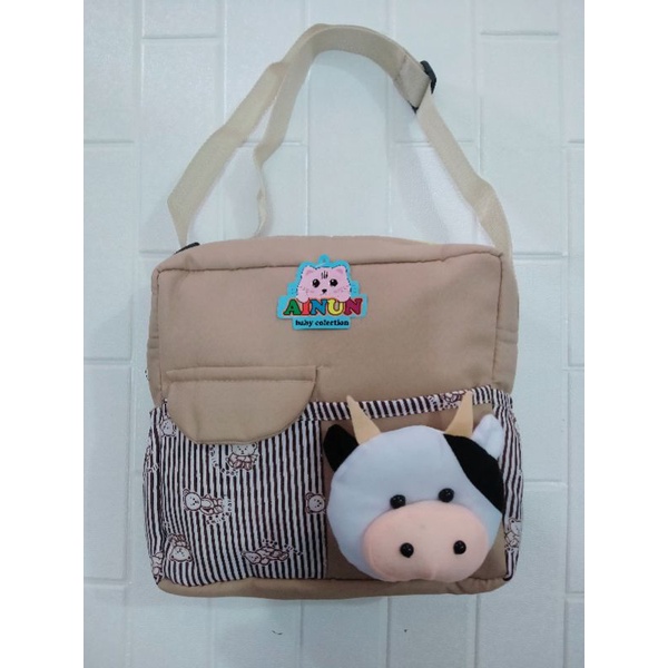 PROMO !!! Tas bayi dengan  saku depan tutup dengan tambahan boneka sapi lucu