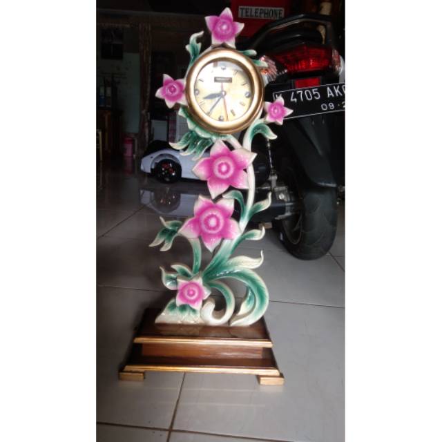 Jam hias ukir kayu jati motif bunga
