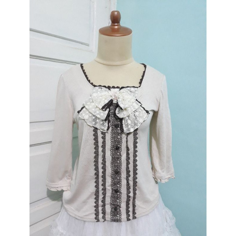 atasan axes femme pita