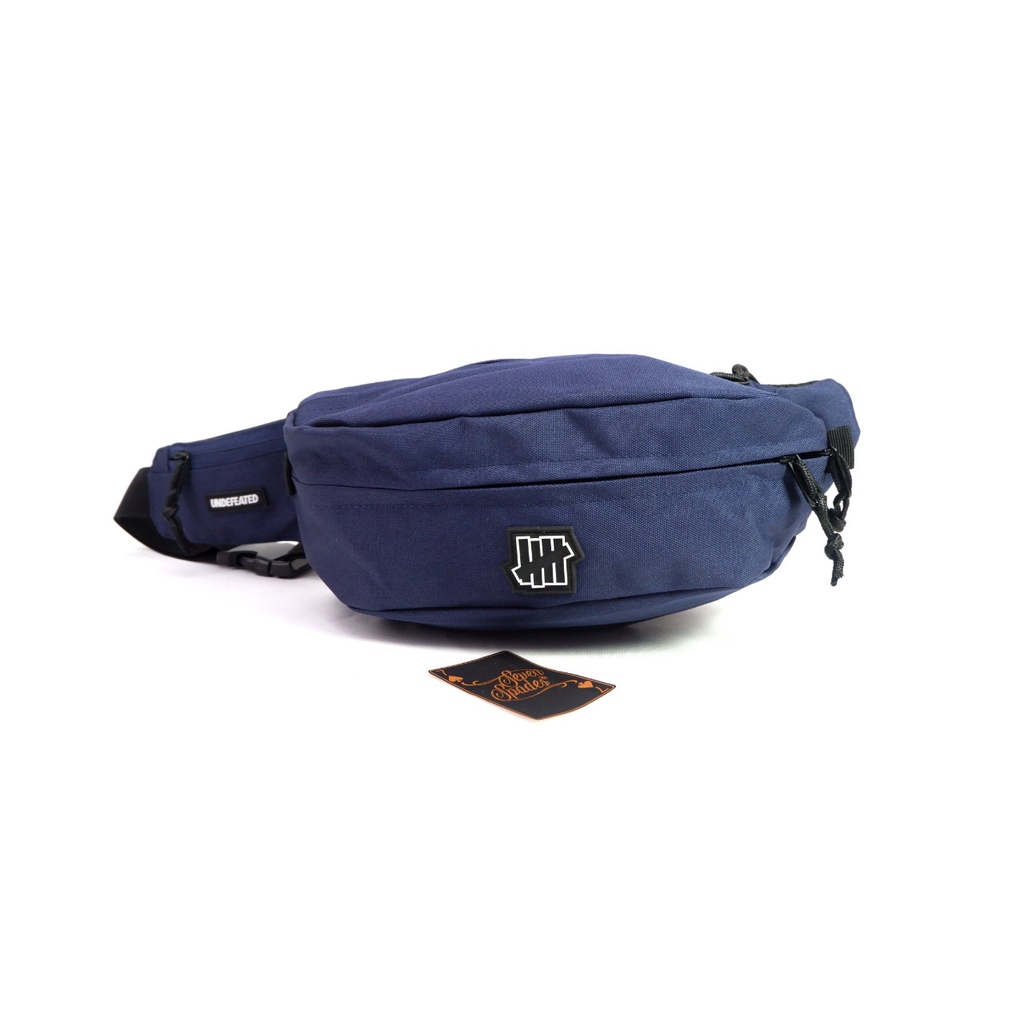 TAS SELEMPANG UNDEFEATED SLINGBAG HYPEBEAST