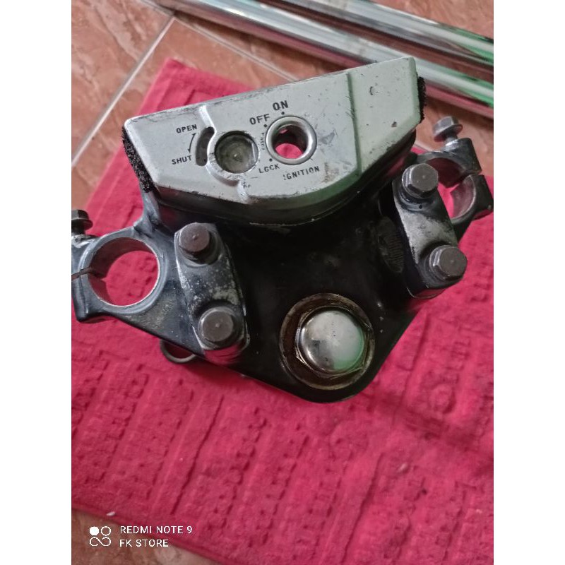 shock depan T atas bawah megapro primus