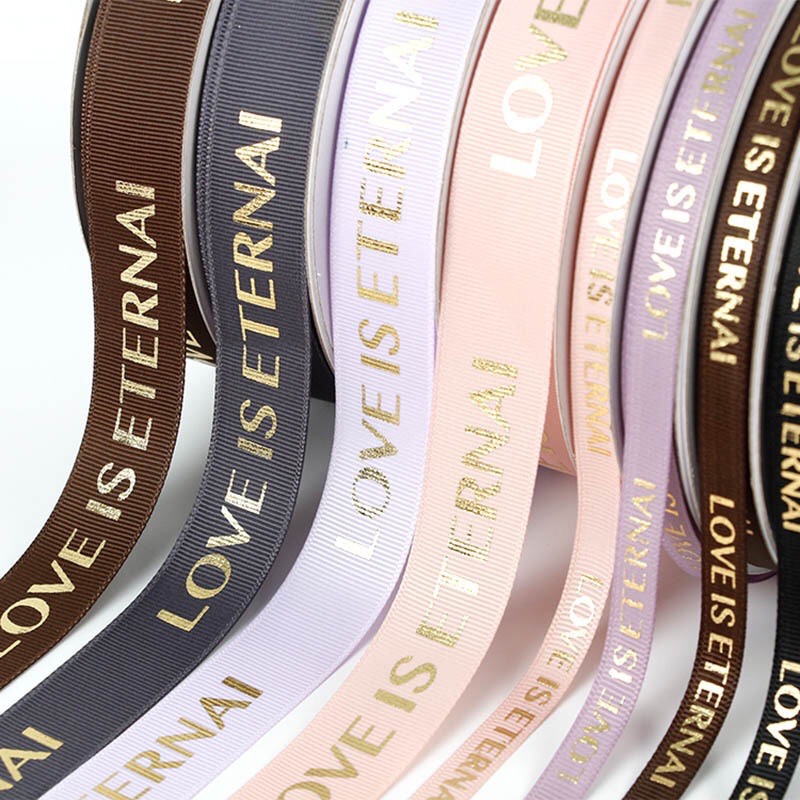 

PITA “ LOVE IS ETERNAL ” LEBAR 1 CM & 2,5CM (ECER PER METER) PITA KADO GIFT BOUQUET BUNGA DEKORASI