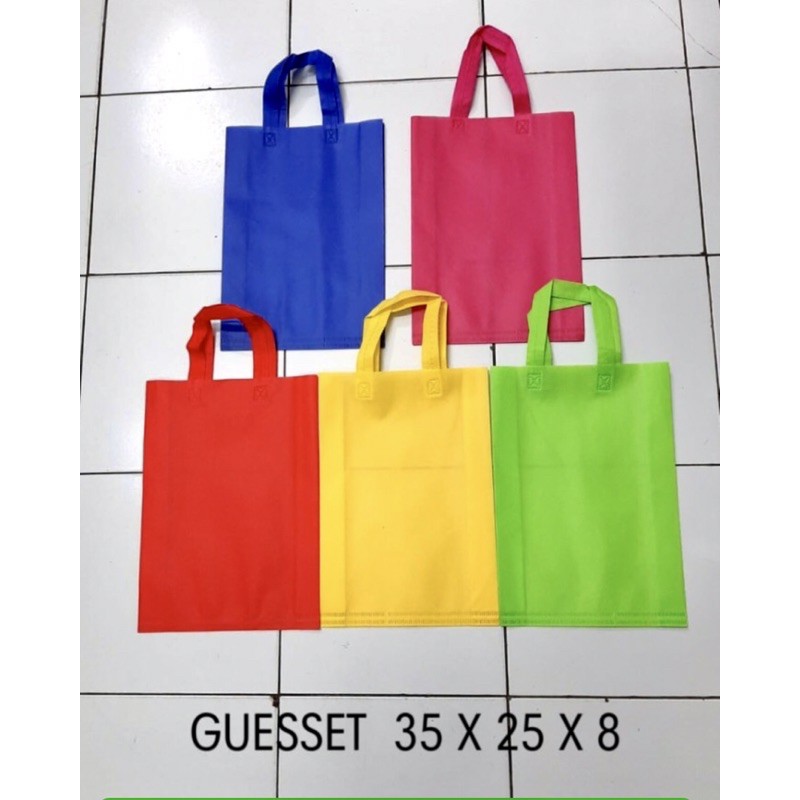 

TAS KAIN /TAS SPUNBOND POLOS HANDLE 25x35 / TAS GOODIE BAG