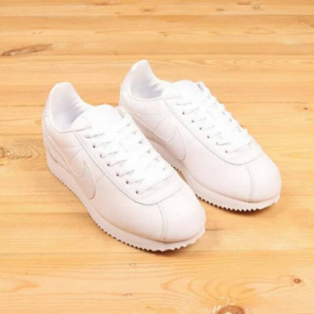 all white cortez womens