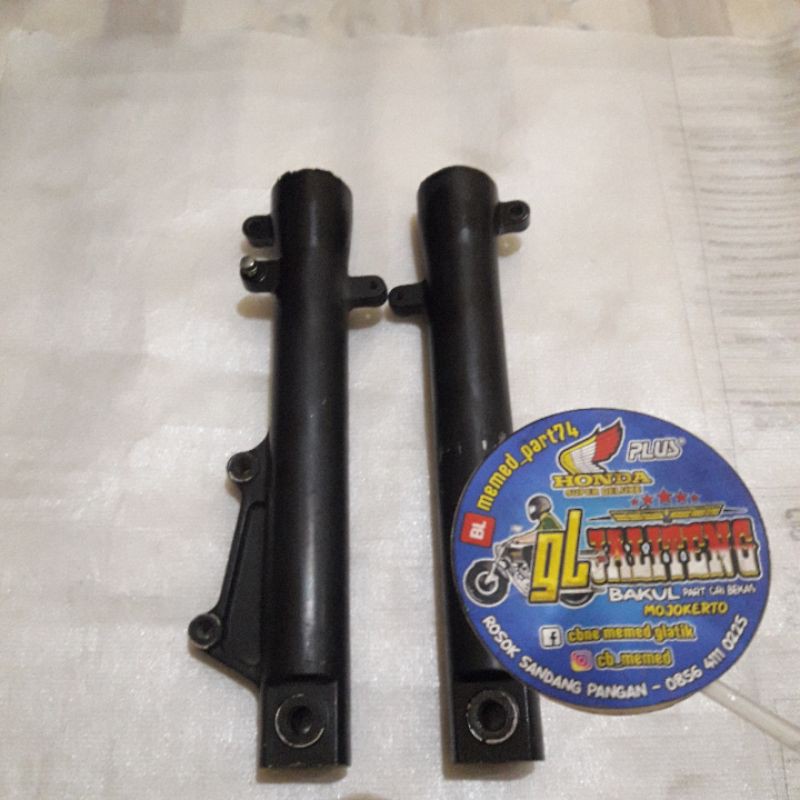 Bottom shock /bumbungan shockbreaker kanan kiri depan tiger revo jaminan original copotan