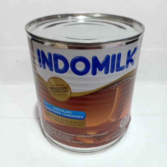 

Susu kental manis indomilk kaleng cokelat