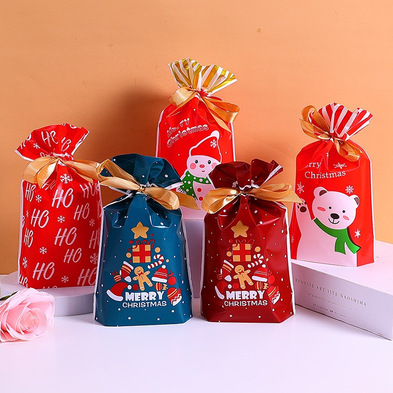 10pcs / Set Kantong Plastik Motif Print Kartun Santa Claus Model Serut Untuk Dekorasi Natal