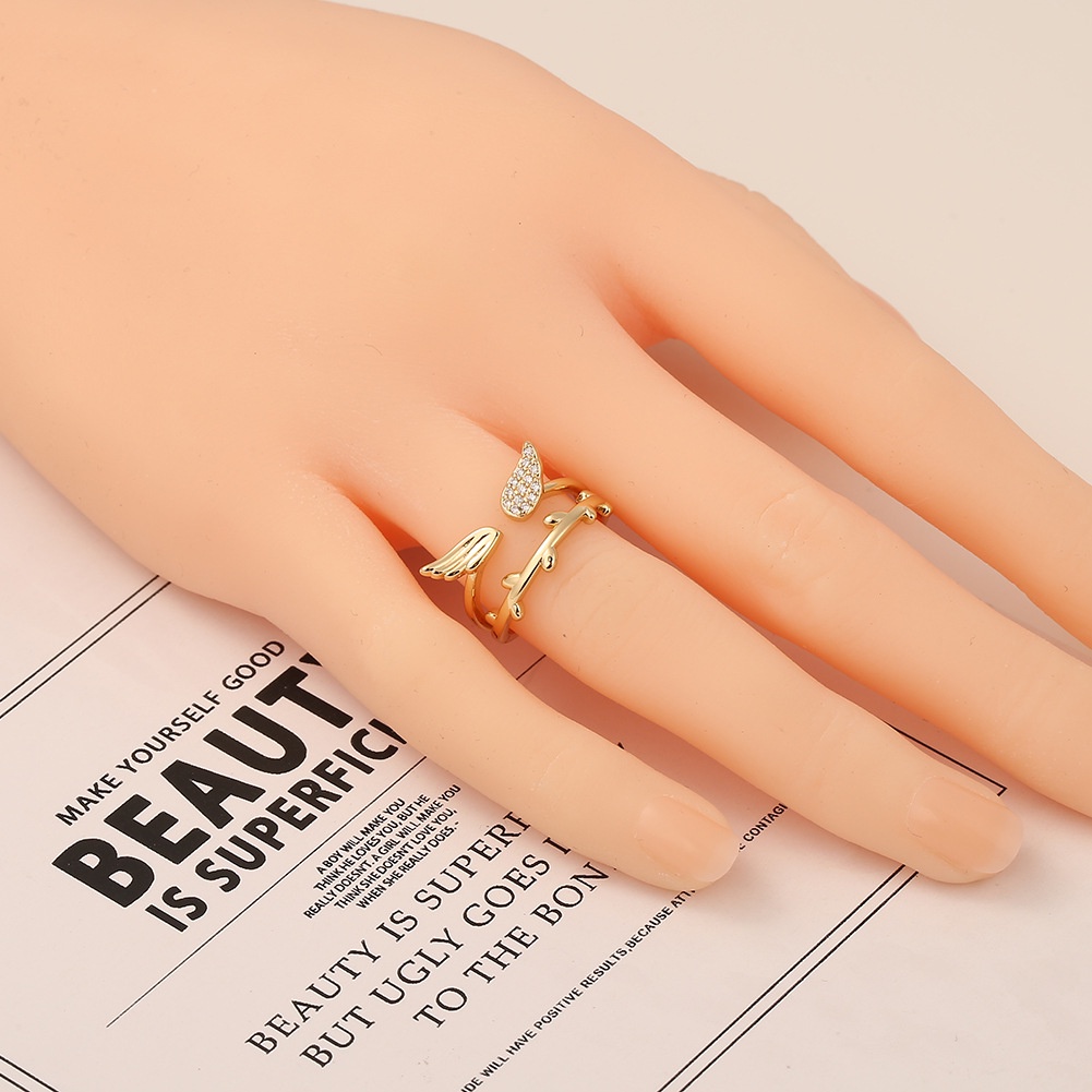 Eropa dan Amerika perhiasan tembaga 18K emas bulu sayap terbuka cincin berlian kreatif pribadi perhi