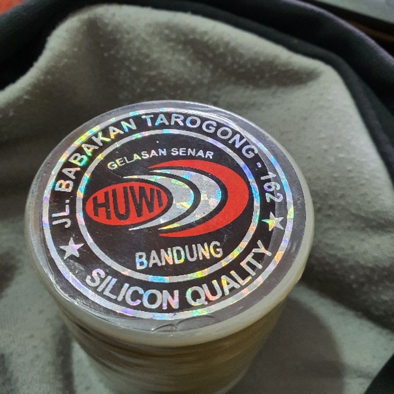 

Gelasan Huwi Label Terbalik