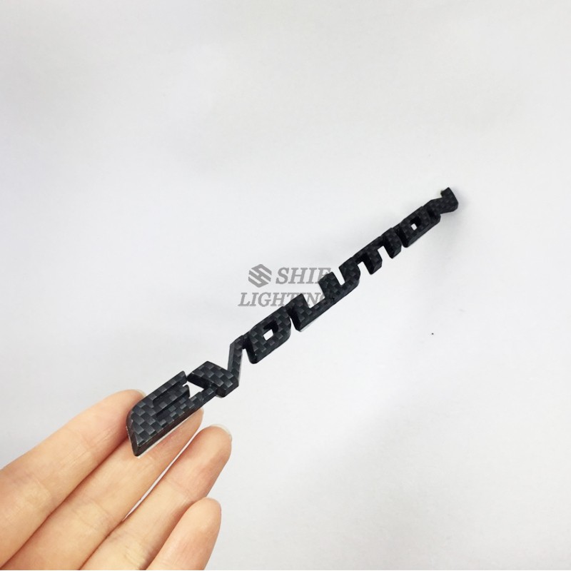 1Pc Stiker Emblem / Badge Motif Evolusi Bahan Carbon Fiber untuk Mobil