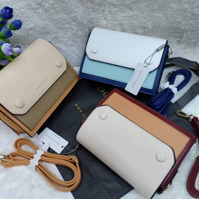 Sling bag charles and keith button