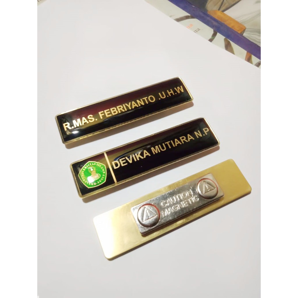 

Name Tag PDH / Name Tag TNI POLRI / PAPAN NAMA DADA PERKANTORAN / NAMTAG KUNINGAN EMAS 8X2 TERLARIS