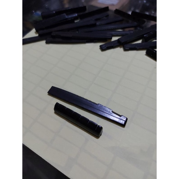 saddle nut gitar akustik