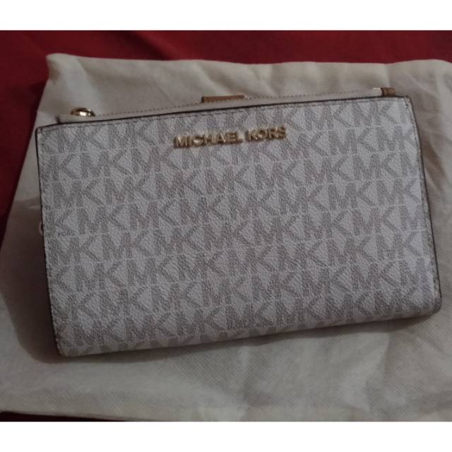 Dompet MK jet set travel double zip wristlet wallet (preloved)