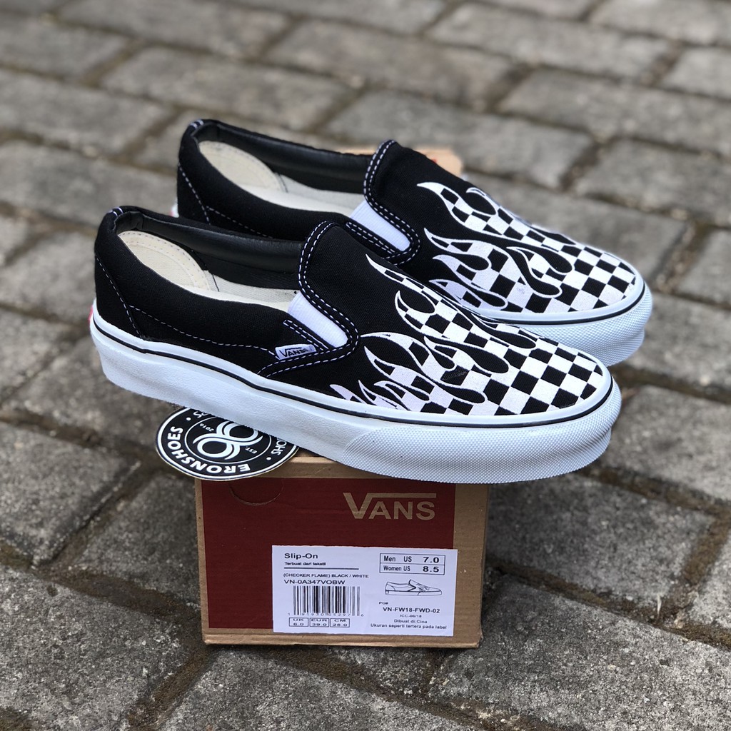 flame checkerboard slip on vans
