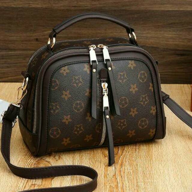 Tas slempang bunga LV