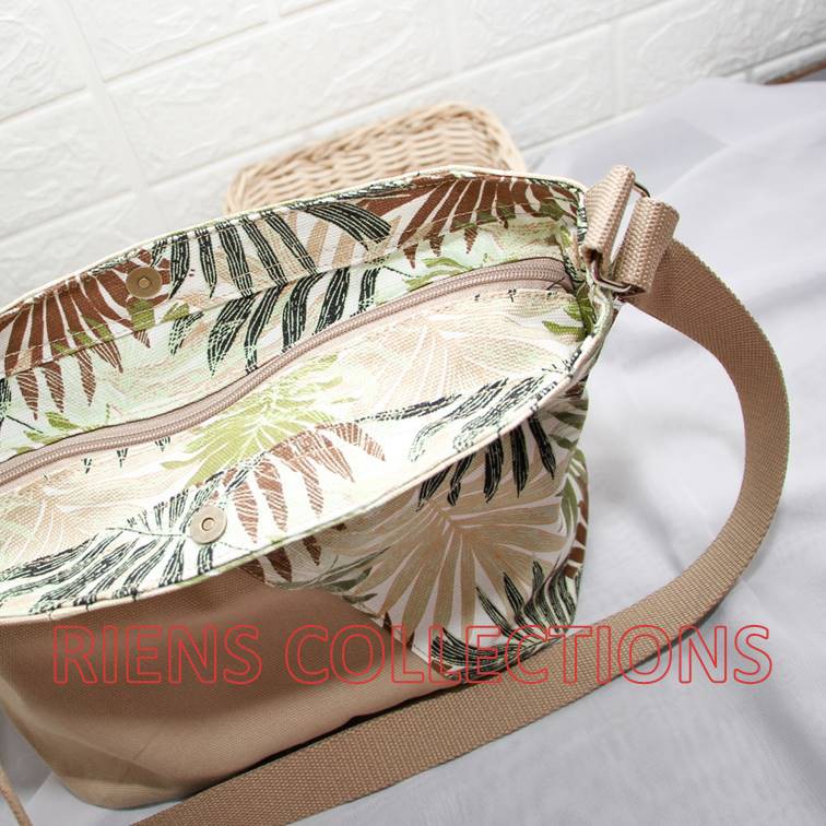 RIENS COLLECTIONS. TAS SELEMPANG SLING BAG KANVAS KOMBINASI FLORAL PALM COKLAT SLC0103