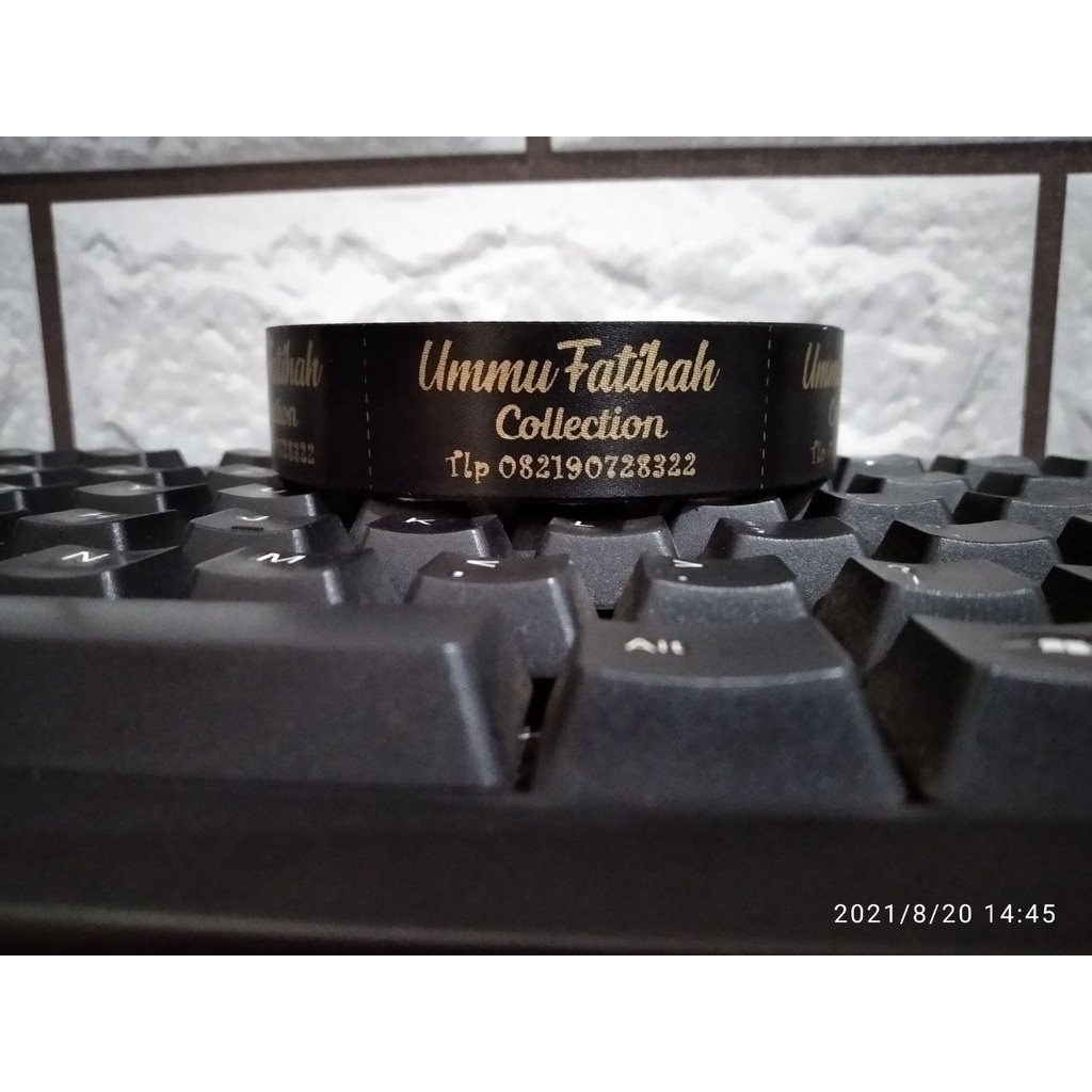 

Label katun Hitam halus 2 cm/label katun/label baju/label hijab/label katun sablon