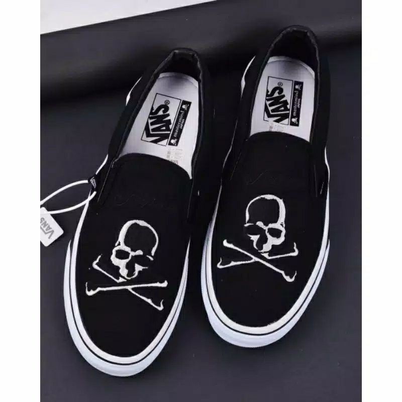 skeleton vans slip ons