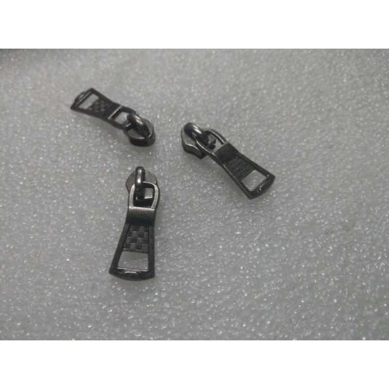 kepala resleting gigi coil plastik no.5 warna black nikel (200 pcs).