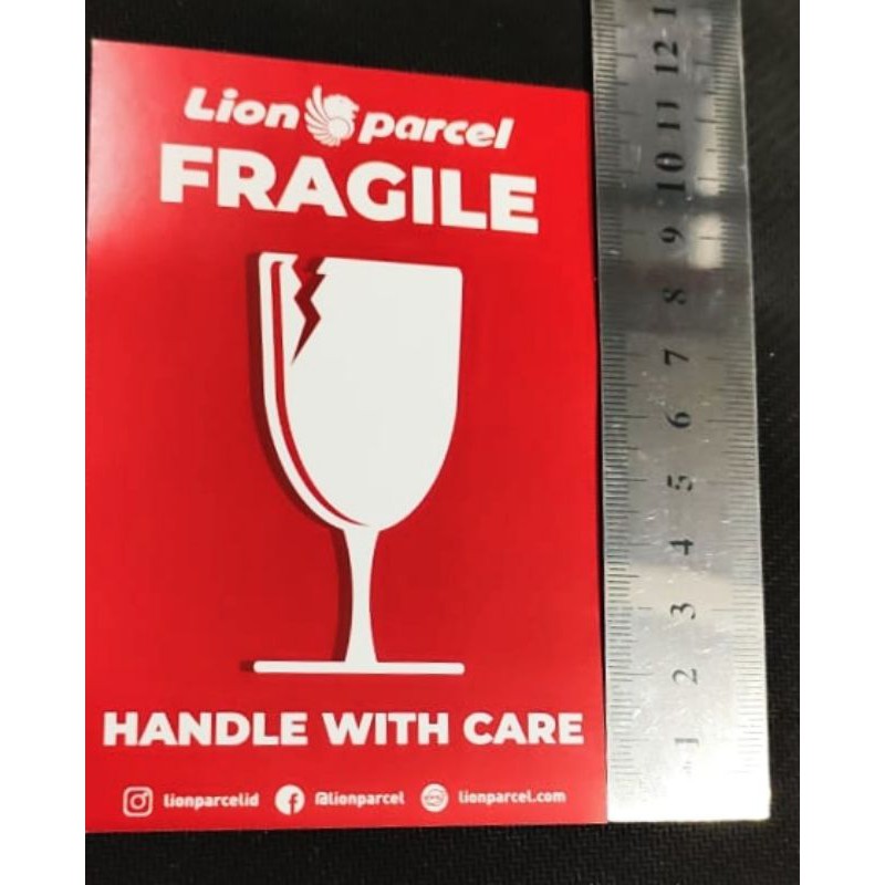 

STIKER FRAGILE LION PARCEL ukuran 11,5cm X 7,5cm