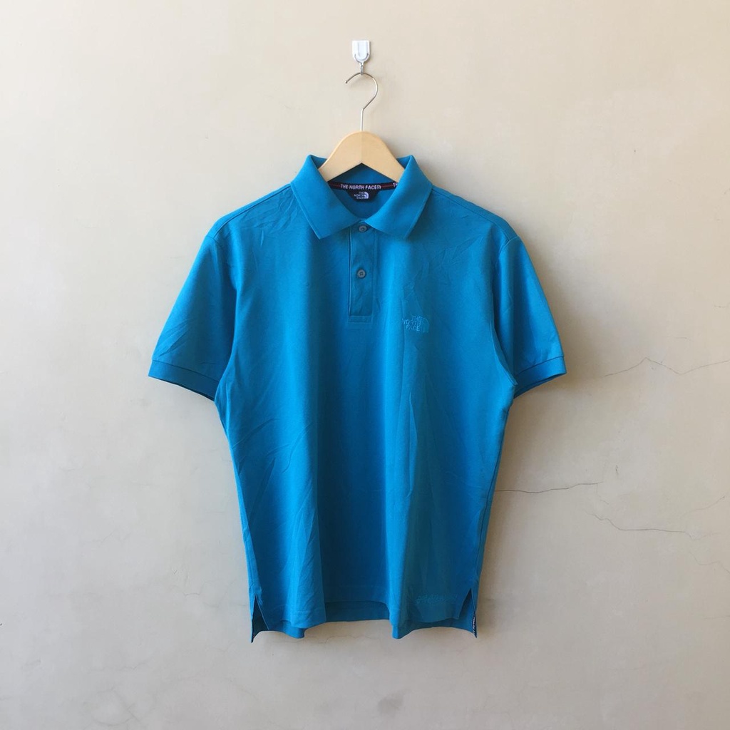 the north face polo shirt warna logo biru produk pakaian brand outdoor second original ukuran M