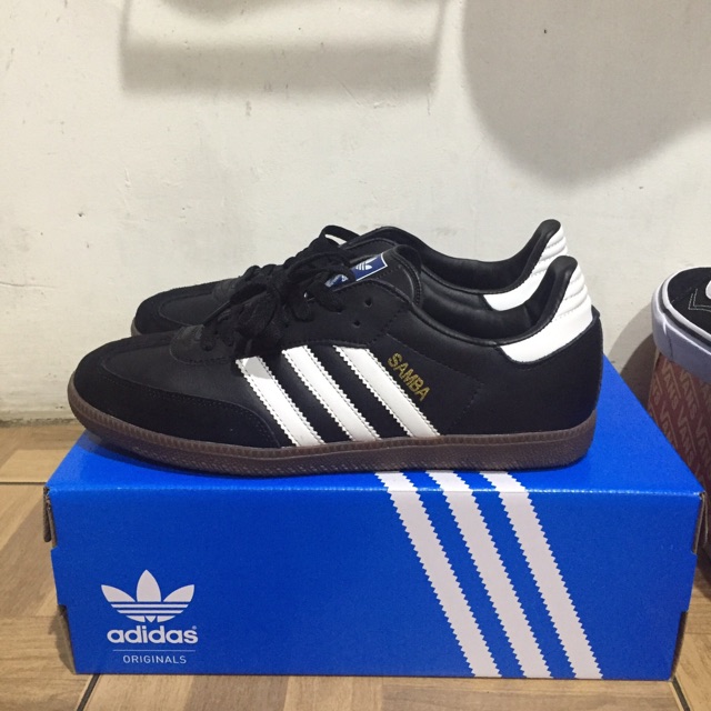 blue adidas samba shoes