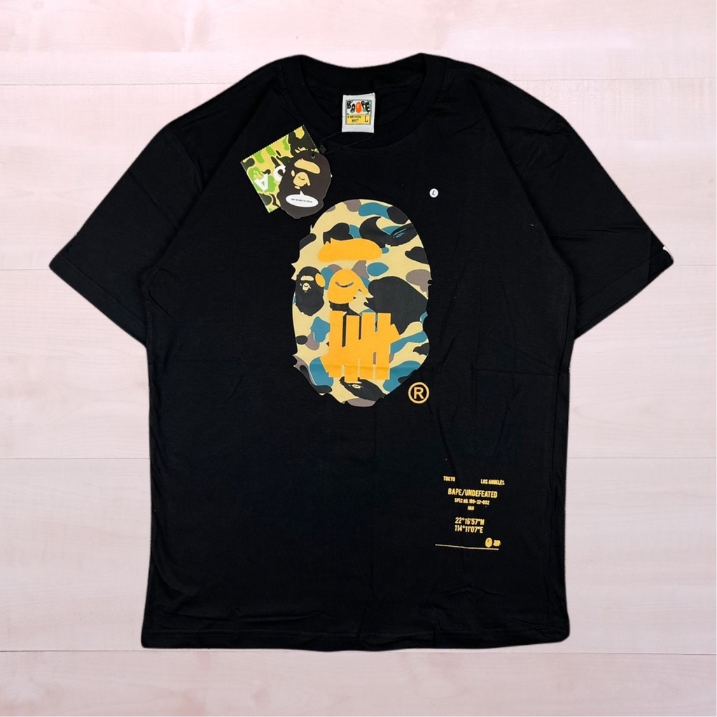 A BATHING APE BAPE CAMO HEAD X UNDEFEATED BAJU KAOS T-SHIRT LOGO BLACK