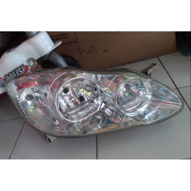 Lampu depan altis 2003