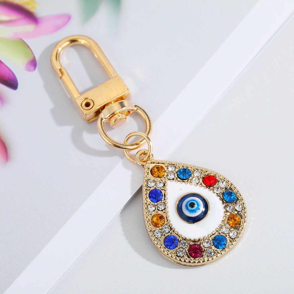 Gantungan Kunci Desain Mata Iblis Bulat Hollow Warna Biru Untuk Pria / Wanita