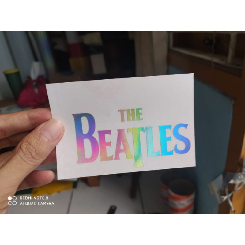 

stiker cutting the Beatles hologram