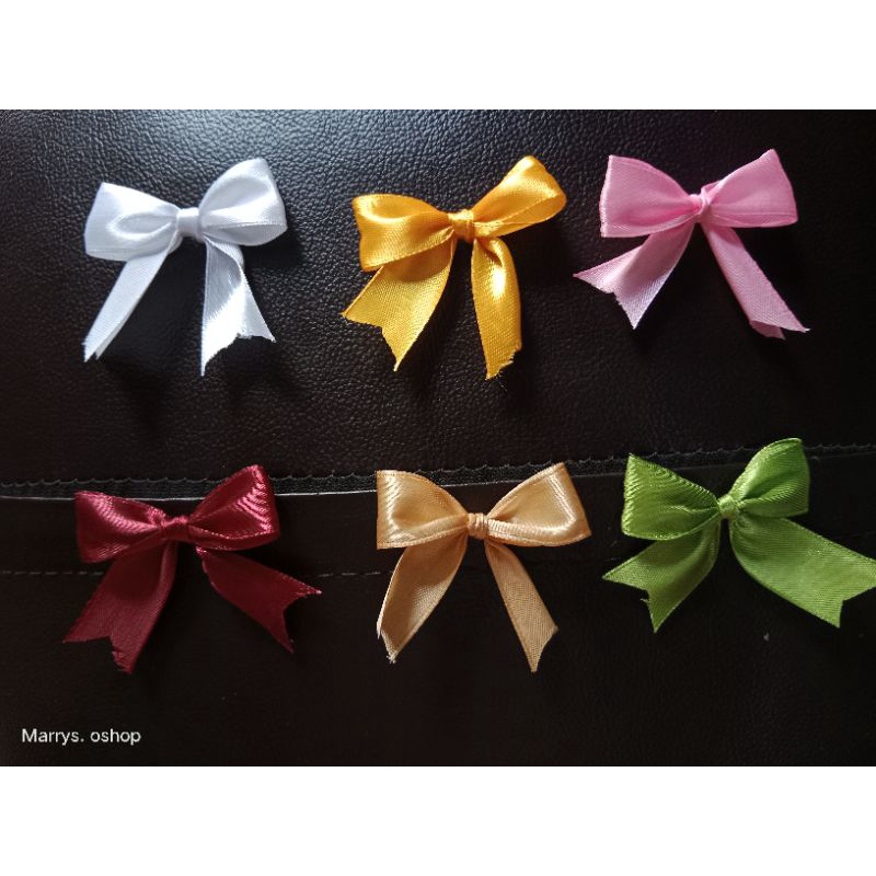 

Pita souvenir isi 100 pita jadi warna