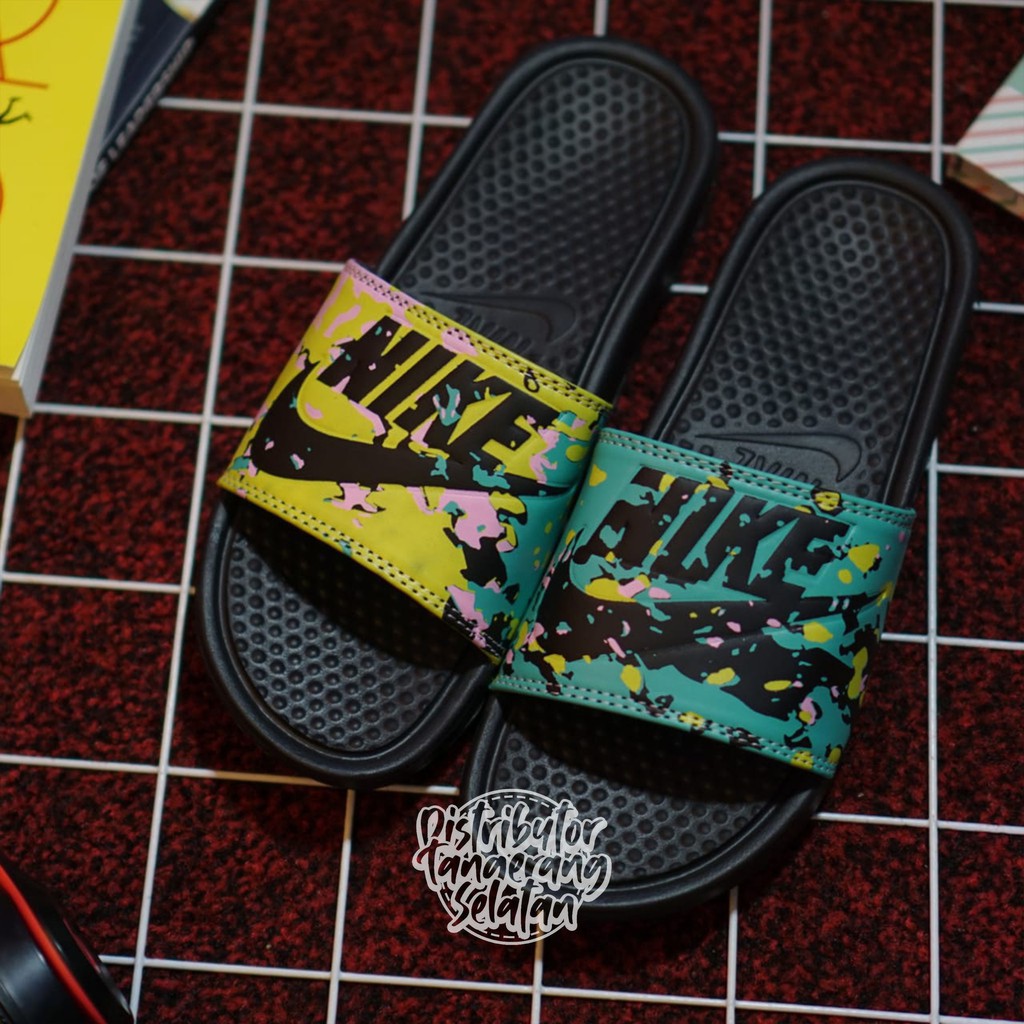 yellow and black nike slides