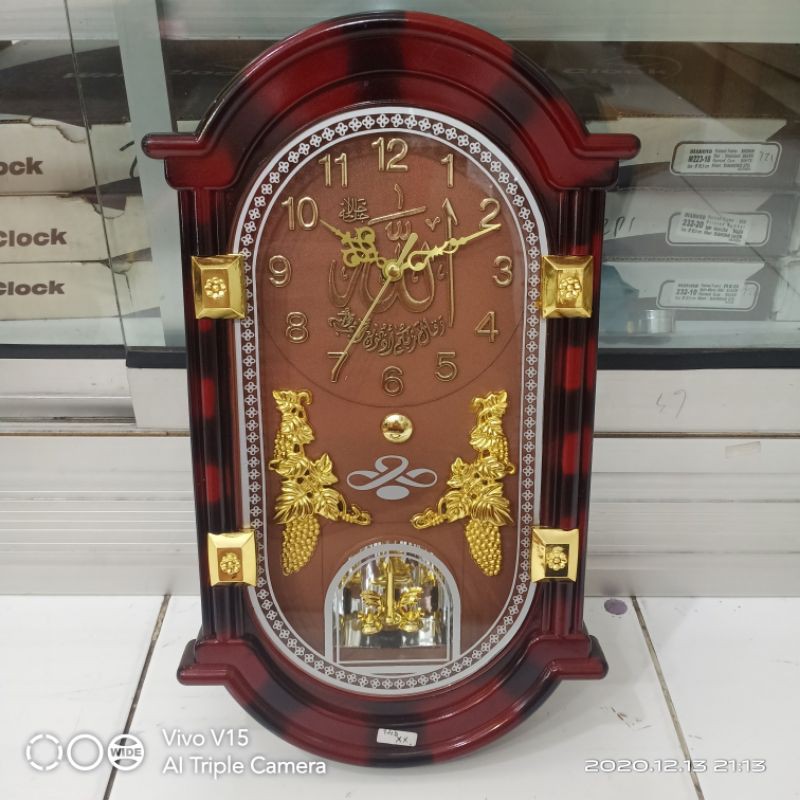 Jam Dinding NIKKO Motif kayu maron Ukuran 36X20CM Melody Setiap Jam Bunyi Bandul Akan Berputar