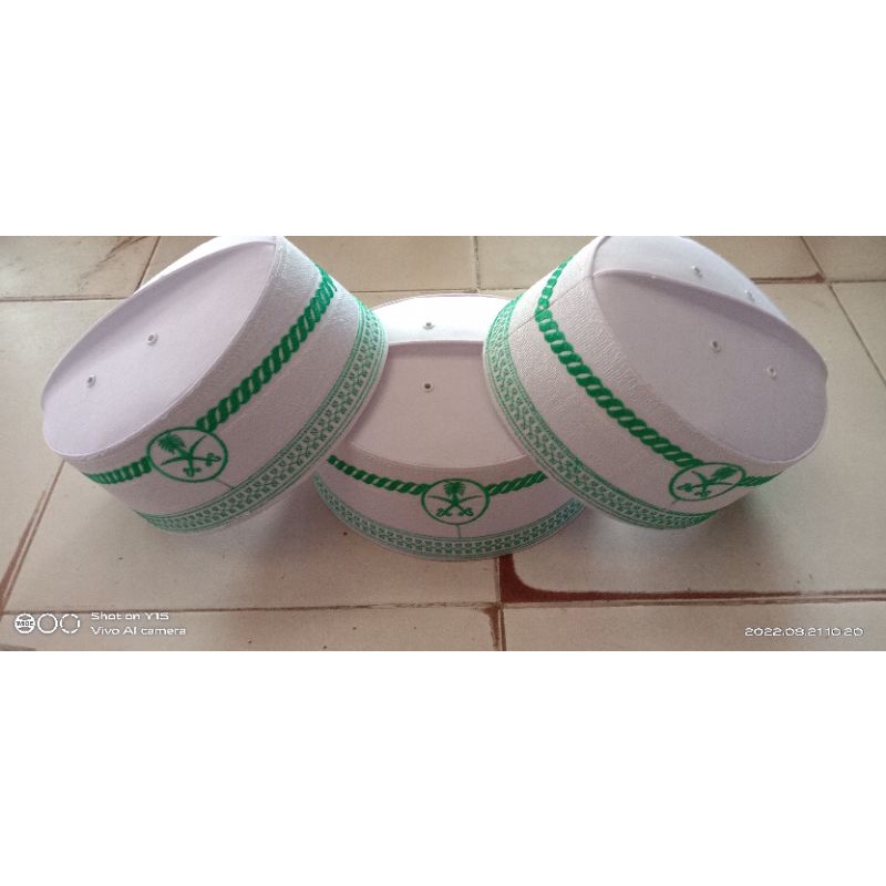 peci assaghofa ust adi hidayat putih logo pedang kurma