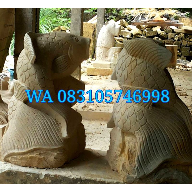 patung ukir batu paras  motif ikan