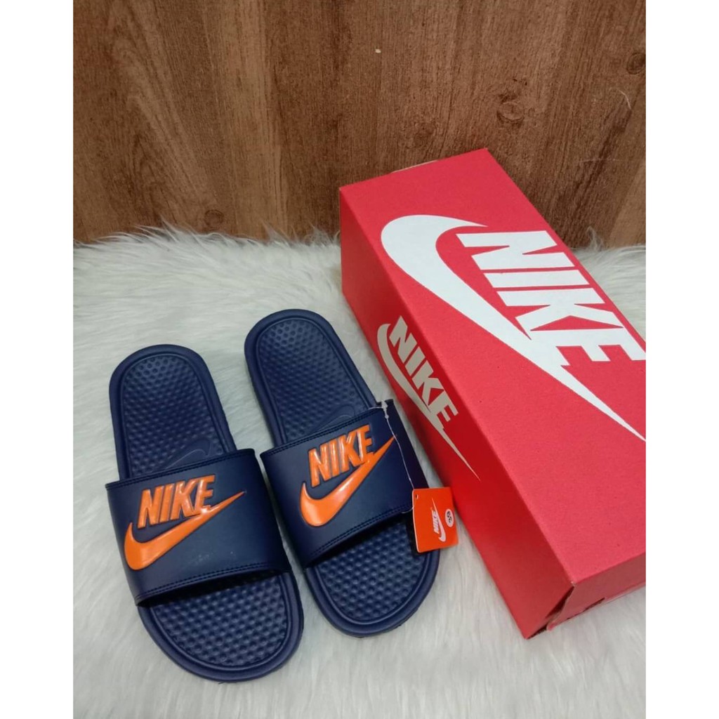 orange nike benassi slides