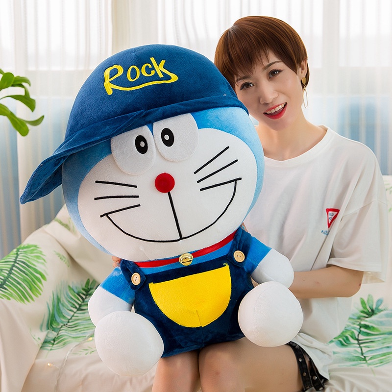 Boneka doraemon kostum pakai topi rock bahan plush