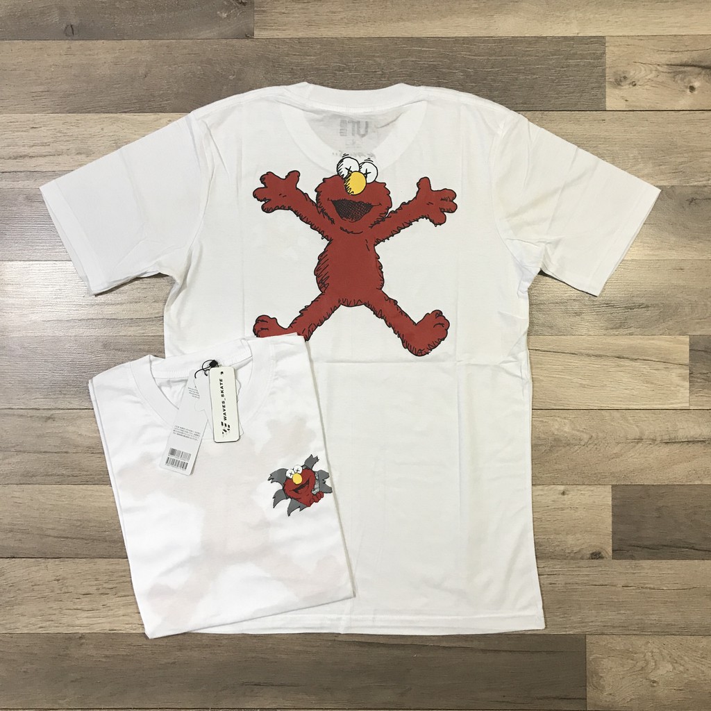 KAOS UNIQLO x KAWS (SUMMER UT GRAPHIC BLACK) - 100% COTTON - TERLARIS-ELMO PUTIH