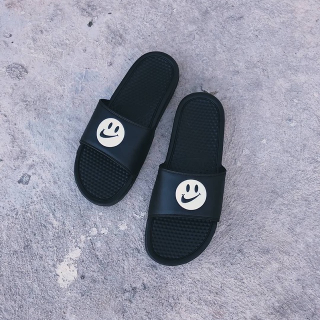 nike slides with smiley face