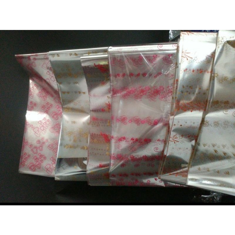 

Isi 50 lbr Plastik Kaca OPP Lembaran MOTIF Kado Bungkus Parcel