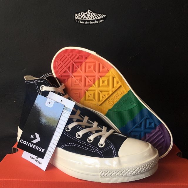 white converse rainbow bottom