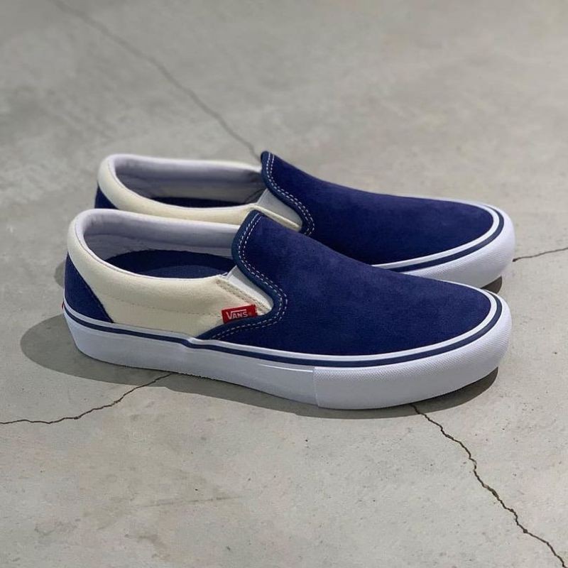 navy vans slip ons